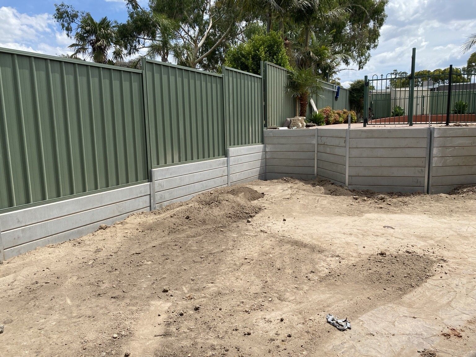 Endeavour Hills project: Concrete sleeper retaining wall with concrete sleepers, steel posts made to suit, access through the garage only. Photo 1 of 6.