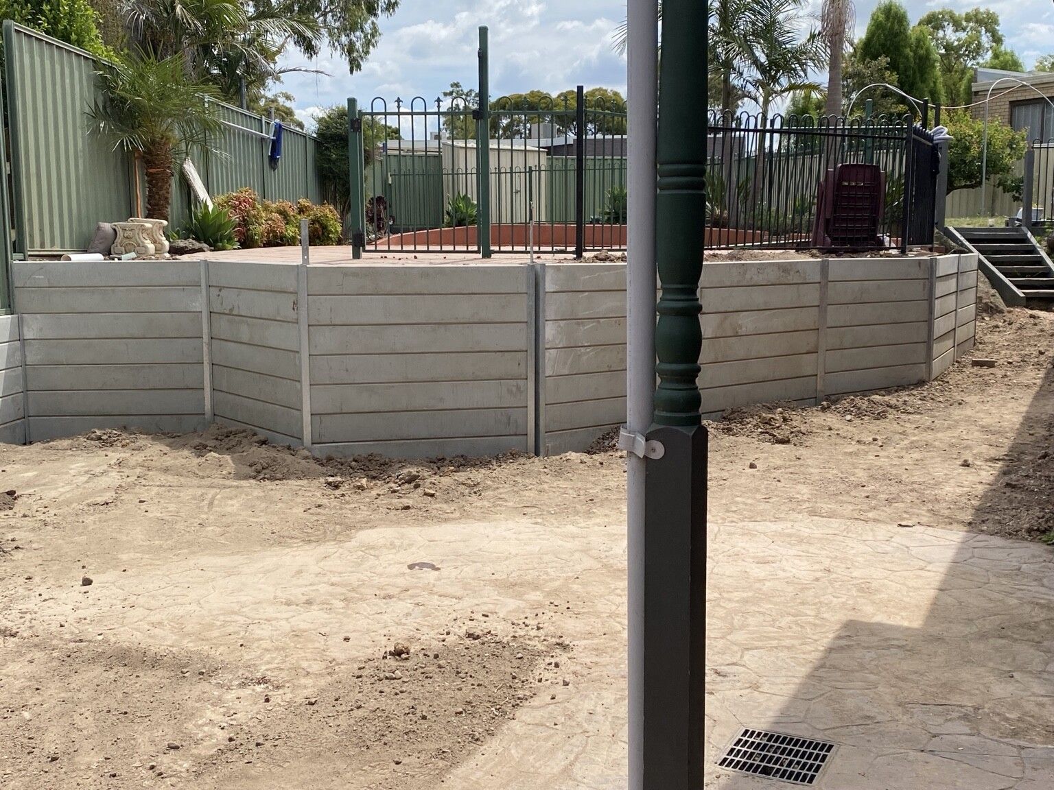 Endeavour Hills project: Concrete sleeper retaining wall with concrete sleepers, steel posts made to suit, access through the garage only. Photo 6 of 6.