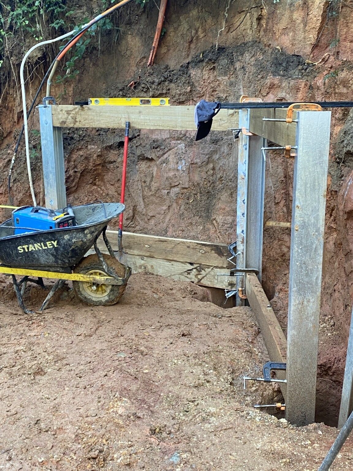 Ferny Creek project: Timber sleeper retaining wall with structural steel posts, stained timber sleepers, drainage to discharge points. Photo 3 of 5.