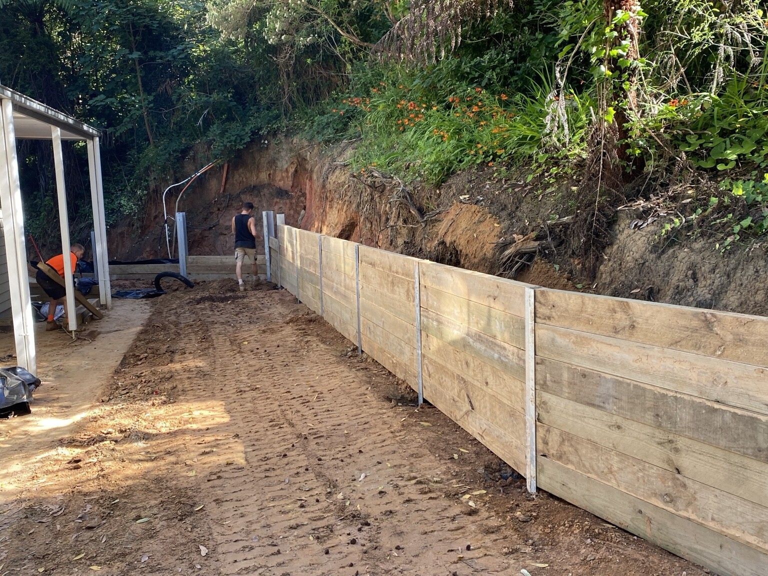 Ferny Creek project: Timber sleeper retaining wall with structural steel posts, stained timber sleepers, drainage to discharge points. Photo 4 of 5.