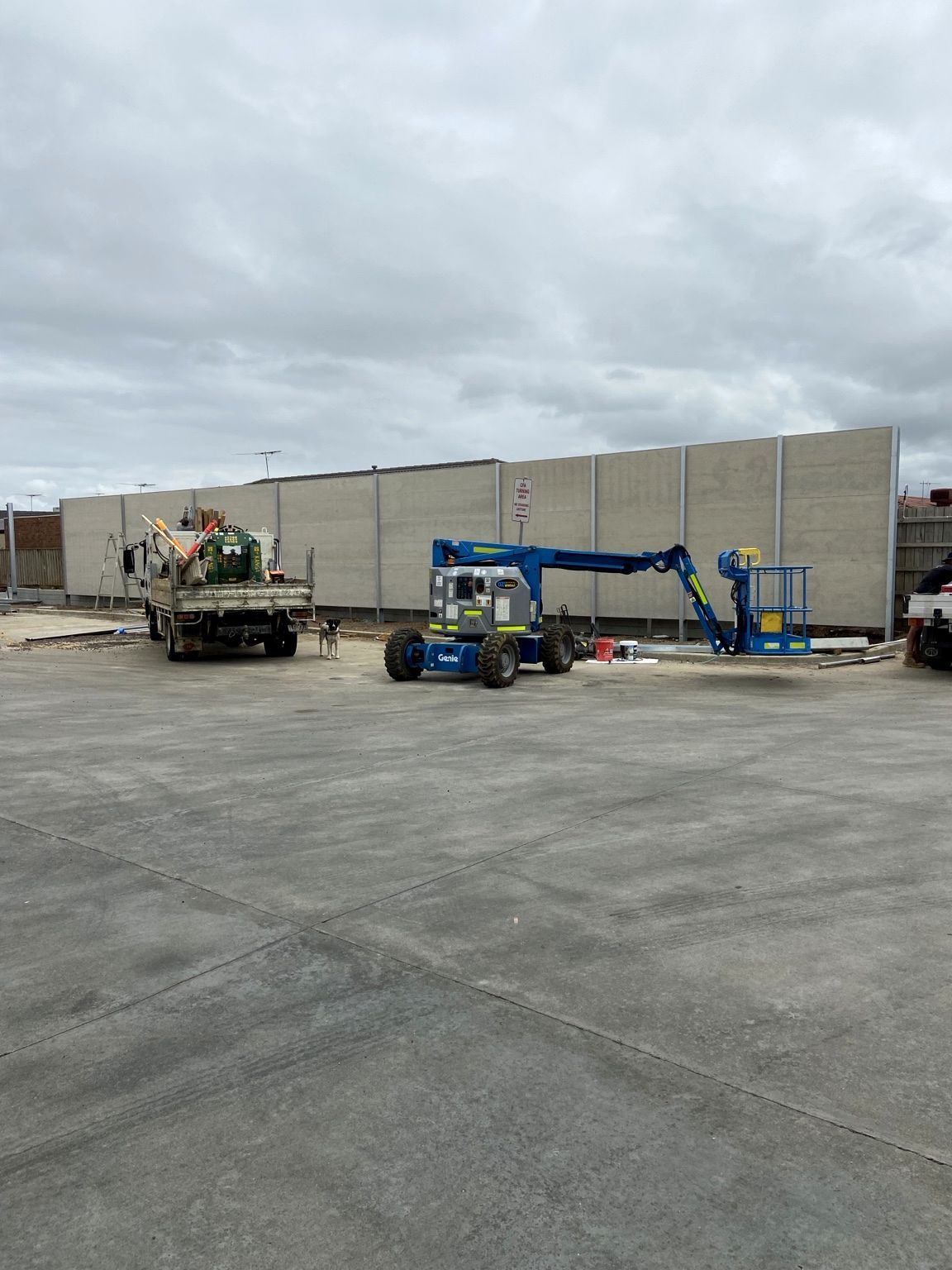 Tall grey acoustic wall panels along the Point Cook loading dock boundary.