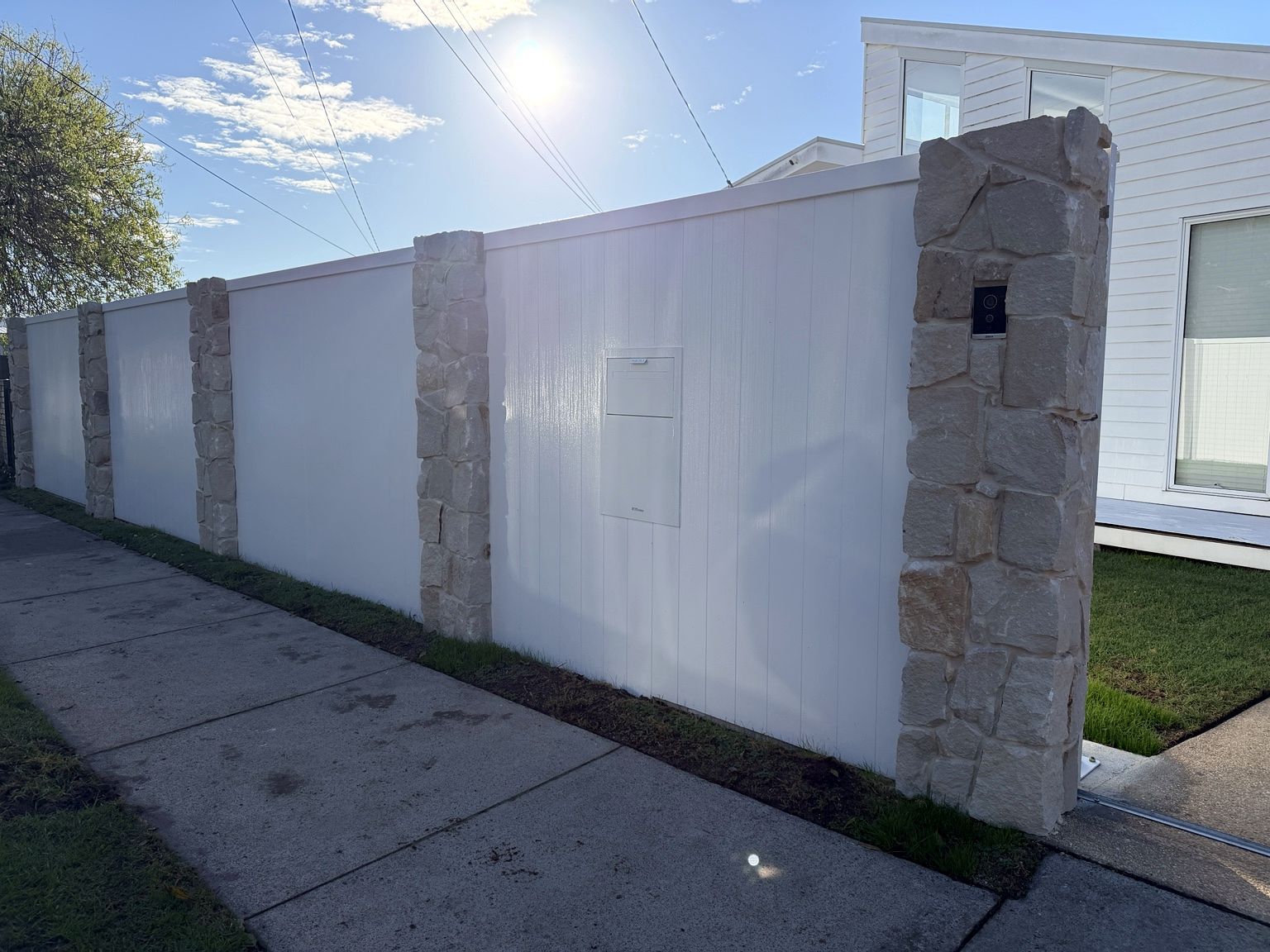 Santorini stone post meeting white EstateWall panels at Seaford.