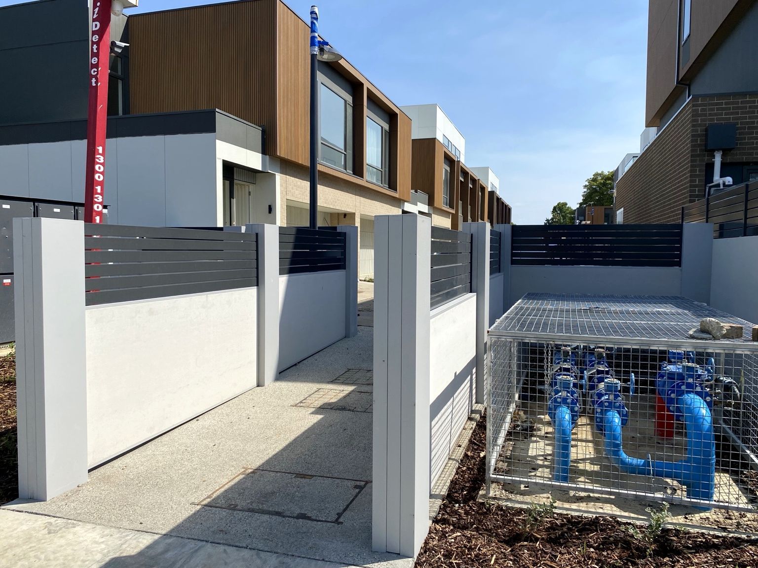 The Glen project: EstateWall with monument horizontal aluminium slats, street entrance, common-area boundary. Photo 6 of 9.