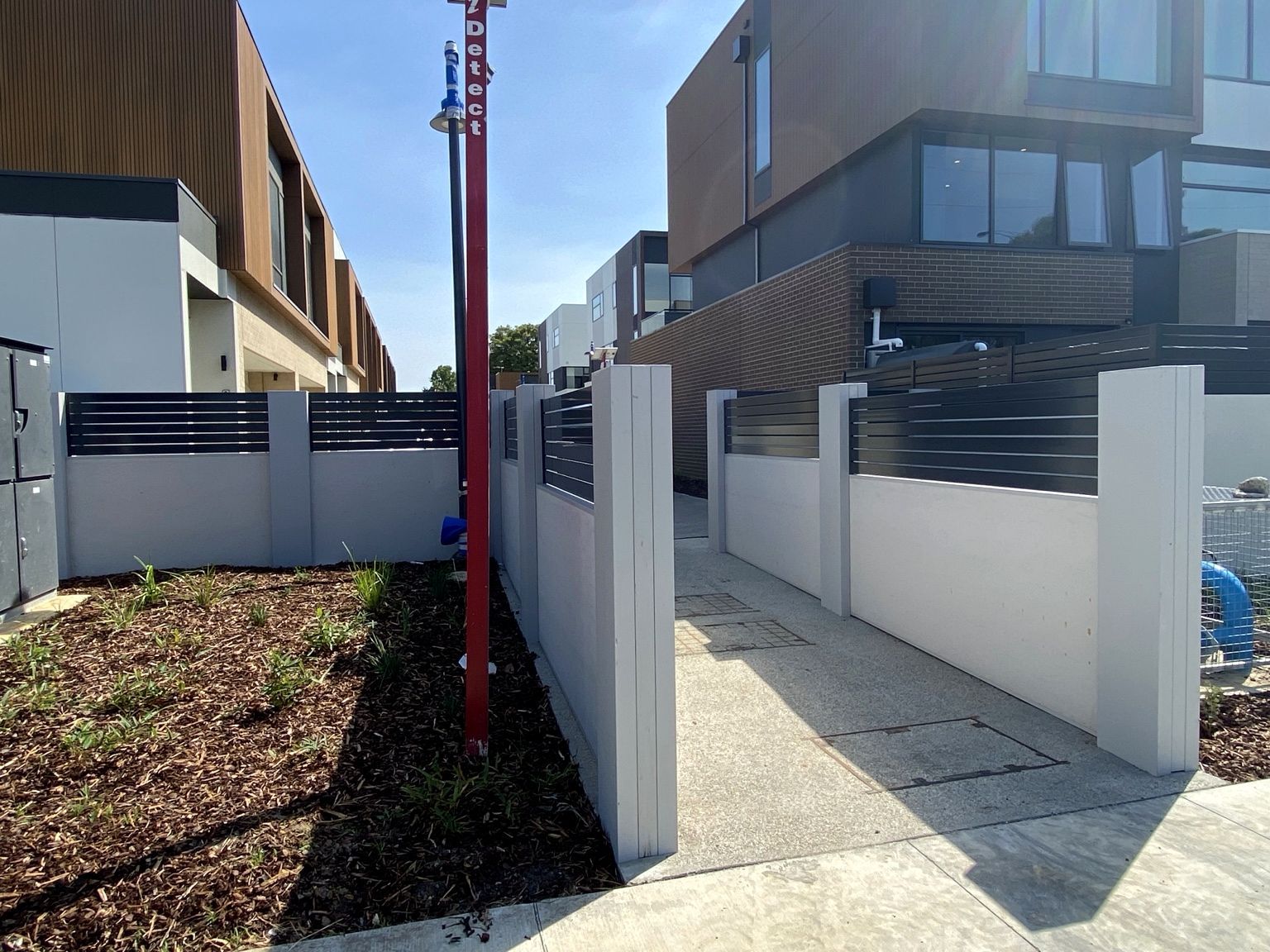 The Glen project: EstateWall with monument horizontal aluminium slats, street entrance, common-area boundary. Photo 9 of 9.